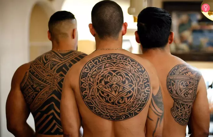 Three brothers sporting Polynesian tattoos on their upper backs