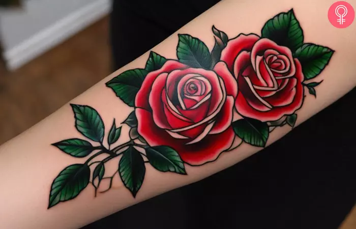 A woman wearing a 3D rose tattoo on her inner arm