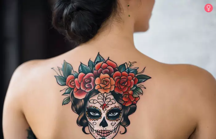 A woman with a skeletal-faced gypsy woman tattoo with a flower crown