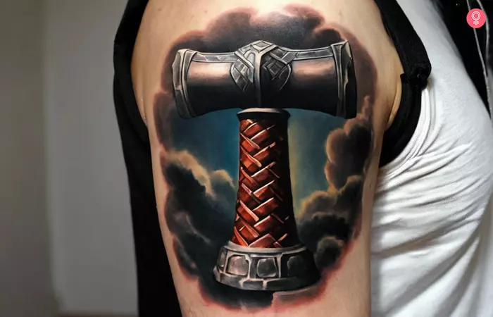 A Thor hammer tattoo on the upper arm