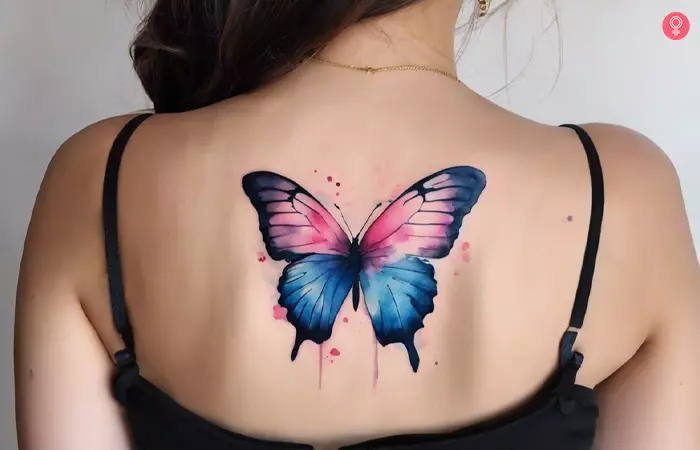 Pink and blue butterfly tattoo