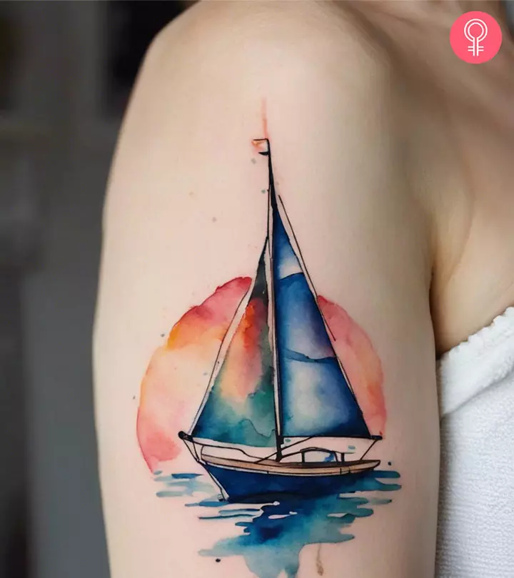 Woman with sailboat tattoo design on her arm