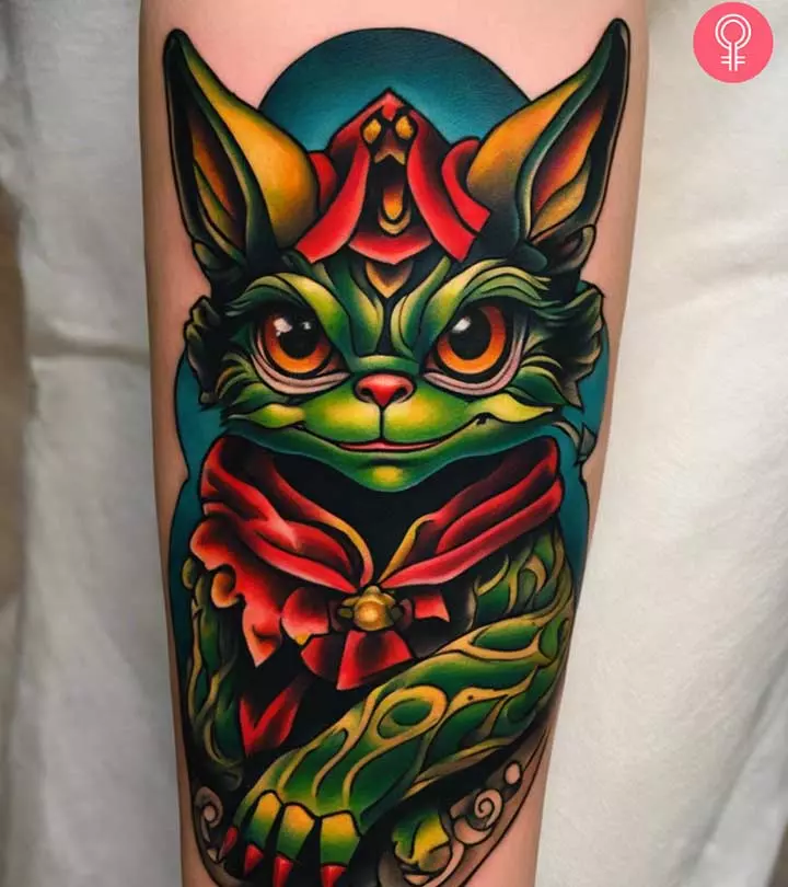 A gremlin tattoo on the forearm