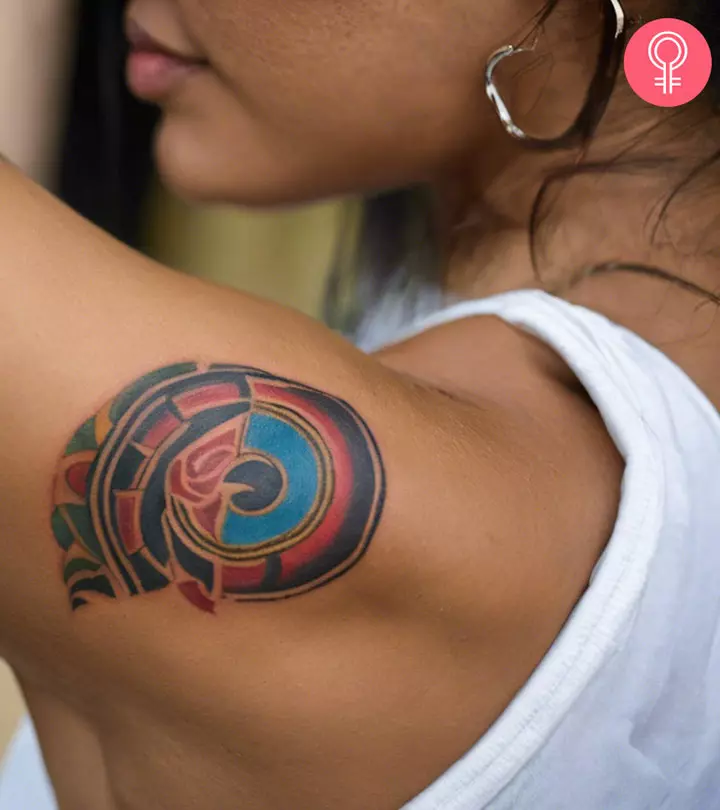 A woman with a Taino tattoo on her upper arm