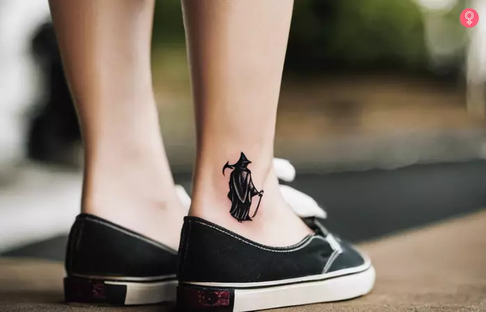 Small Grim Reaper tattoo on the ankle