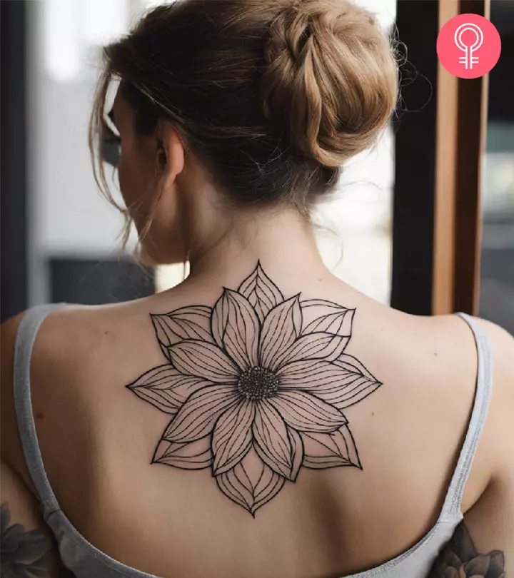 A woman with a flower tattoo on her back