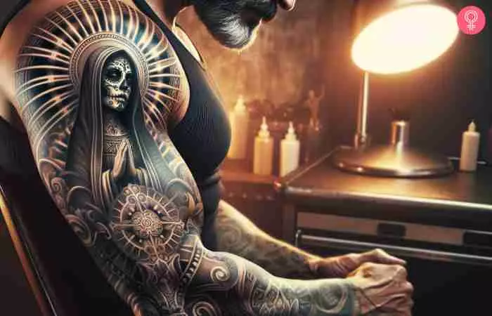 A Santa Muerte prayer tattoo on a man’s arm