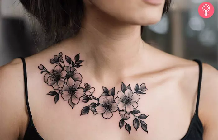 A black cherry blossom tattoo on the chest