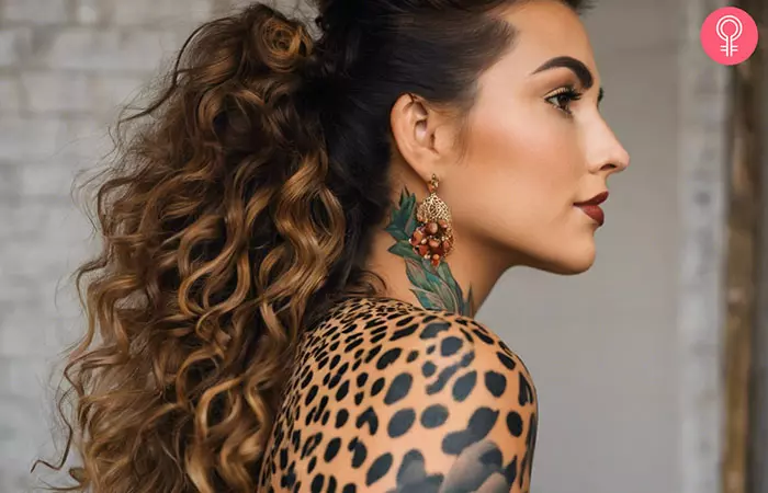 A cheetah print tattoo on a woman’s shoulder