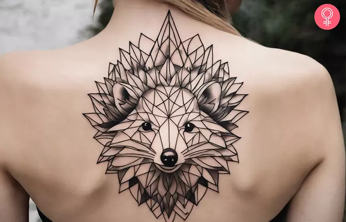 A geometric hedgehog tattoo on the upper back