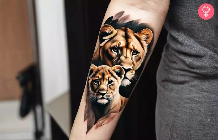 A lioness and cub tattoo on the forearm