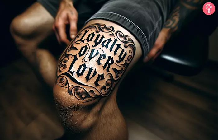 A loyalty over love tattoo on a man’s knee