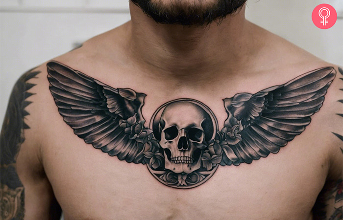 A man showing his memento mori chest tattoo