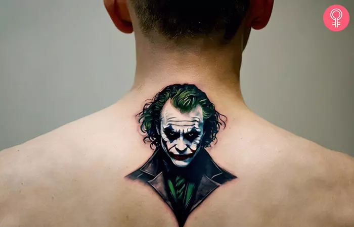 A man with a Heath Ledger Joker tattoo on his upper back