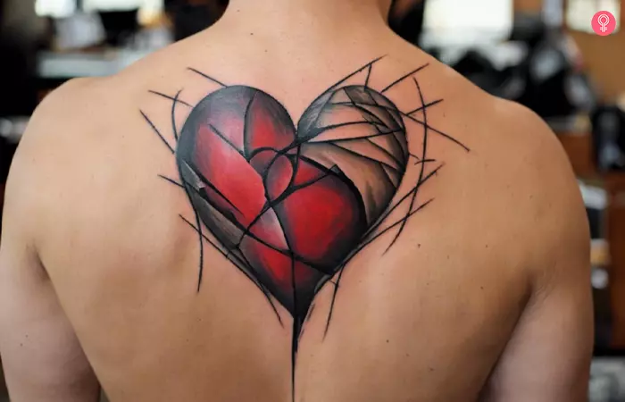 A man with a broken heart tattoo on his shoulder