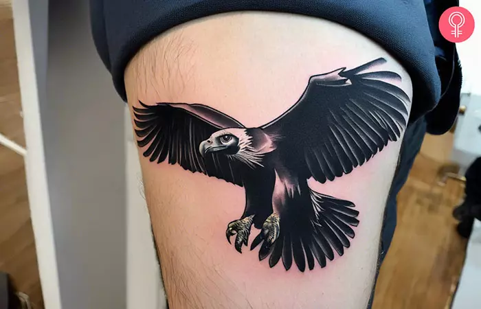 A man with a flying vulture tattoo on his thigh