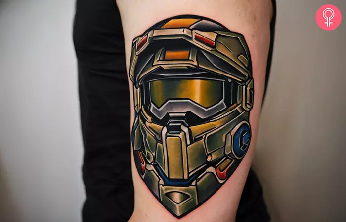 A man with a halo video game tattoo on his arm