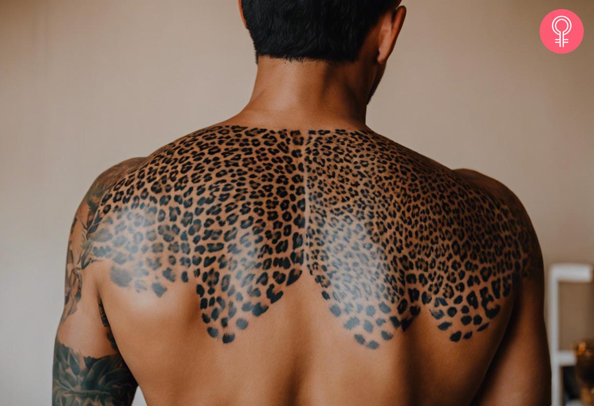 A man with a leopard print tattoo on his back