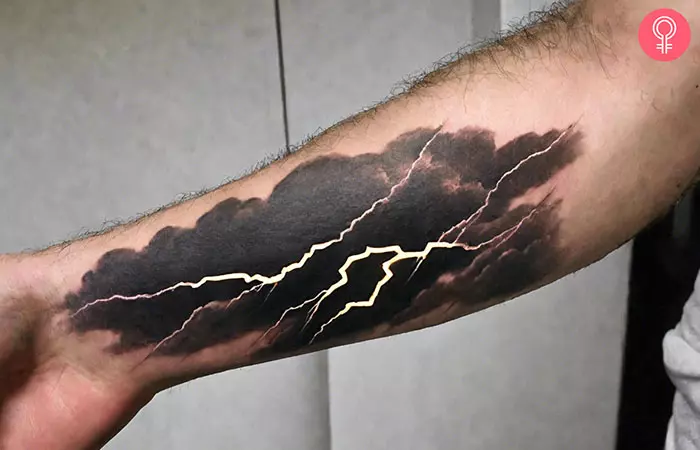 A man with a lightning forearm tattoo
