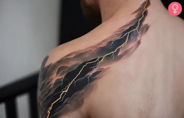 A man with a lightning shoulder tattoo