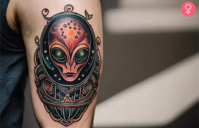 A man with a traditional alien tattoo on his upper arm