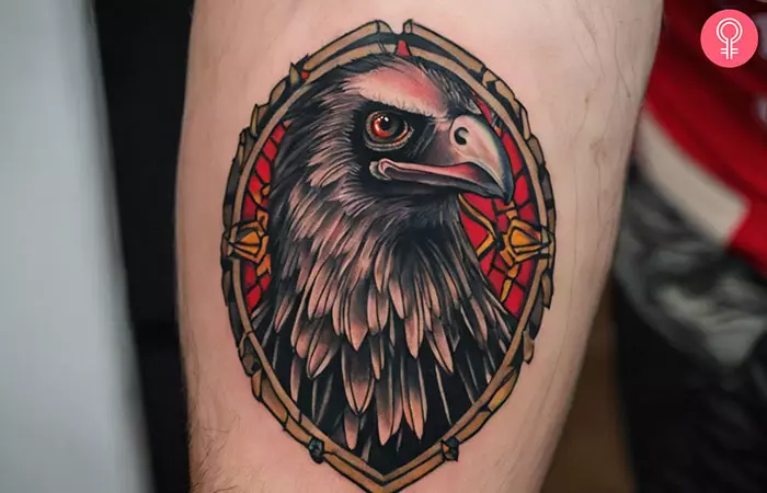 A man with a traditional vulture tattoo on the upper arm