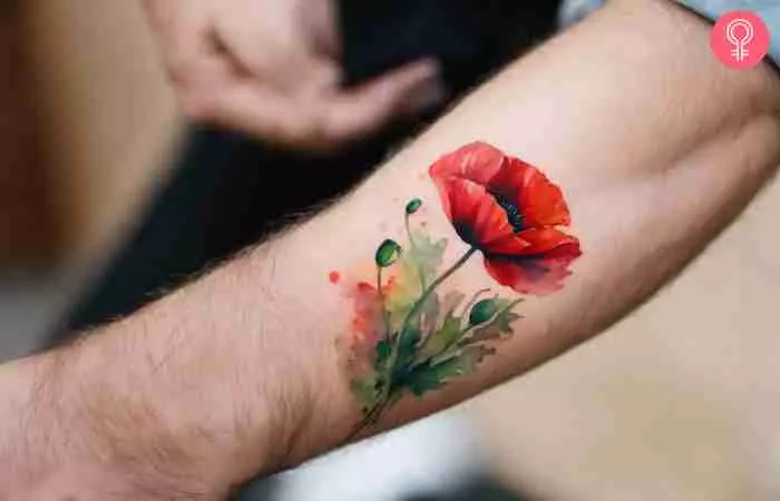 A military tattoo of a poppy flower on a man’s wrist