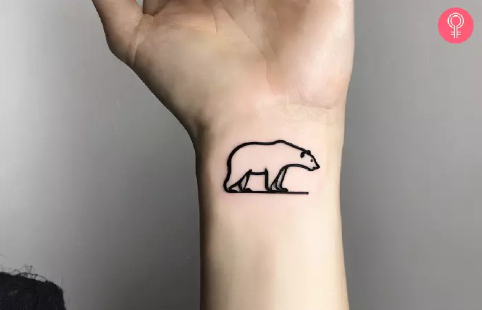A minimalistic polar bear tattoo on the wrist