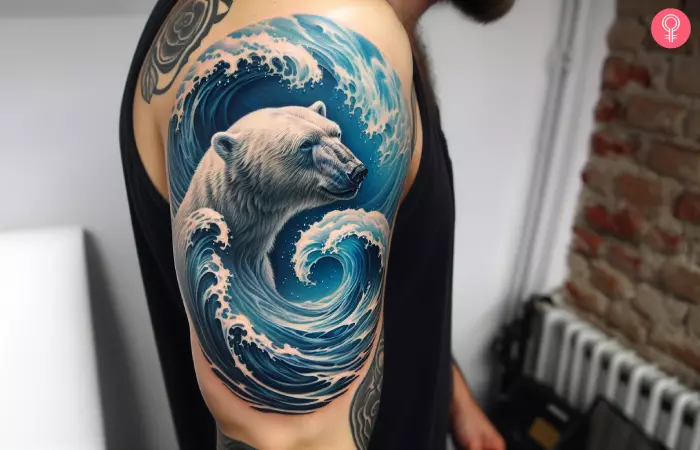 A realistic polar bear tattoo on the upper arm