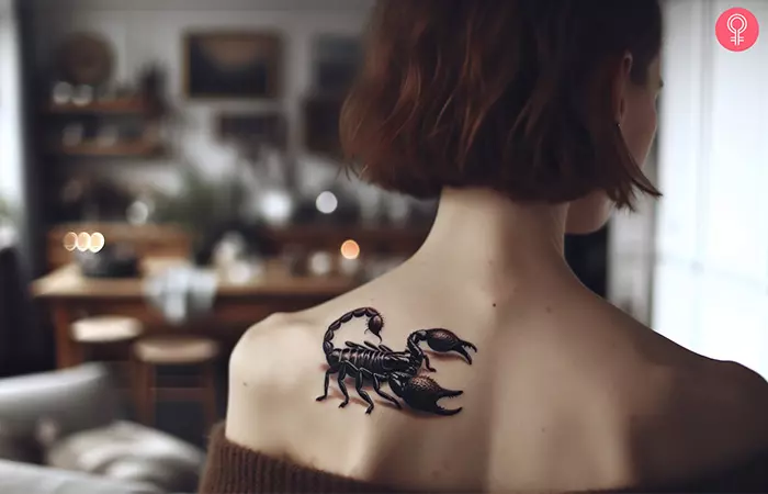 A realistic scorpion tattoo on the upper back