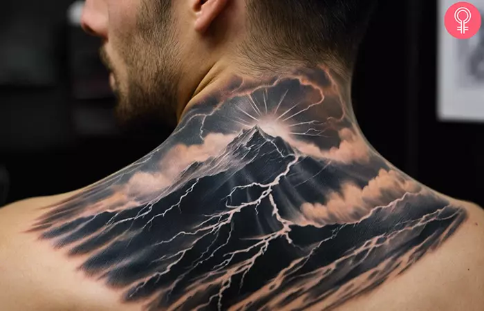 A realistic storm tattoo on the back of a man’s neck