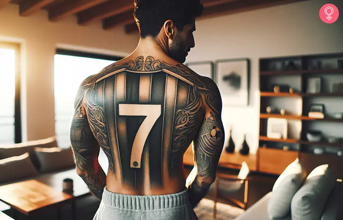 A soccer jersey tattoo on the back of a man