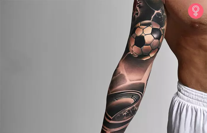 A soccer tattoo sleeve on the arm of a man