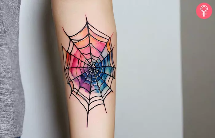 A spider web arm tattoo on the forearm