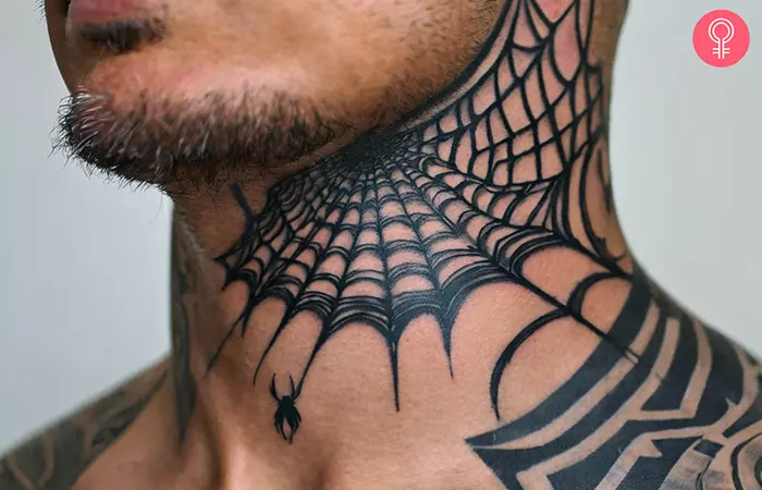 A spider web tattoo on the neck