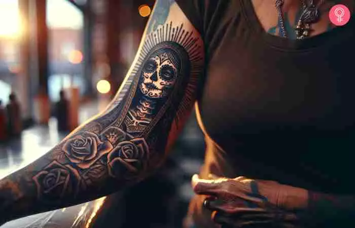 A traditional Santa Muerte tattoo on the arm of a woman