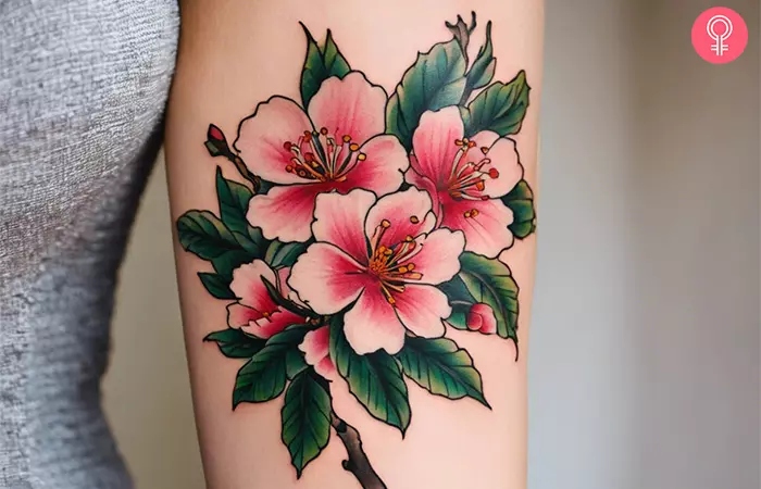 A traditional cherry blossom tattoo on the arm