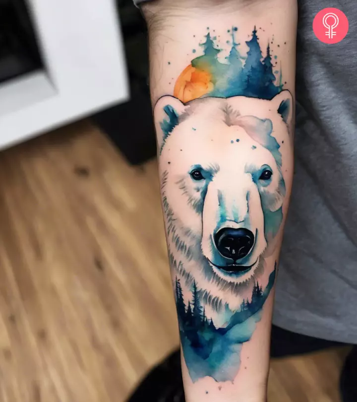 A watercolor polar bear tattoo on the forearm