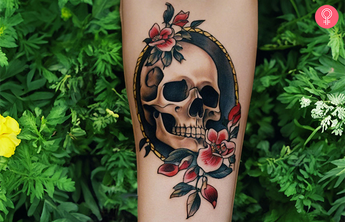 A woman flaunting an old school memento mori forearm tattoo