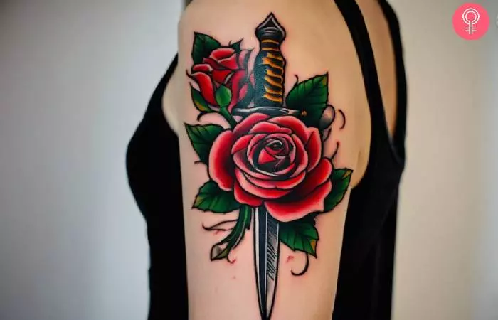 A woman sporting a rose and dagger tattoo