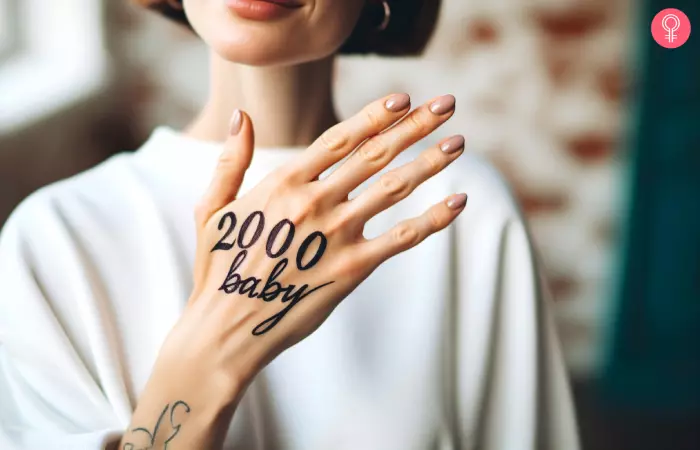 A woman with 2000 baby tattooed on her hand