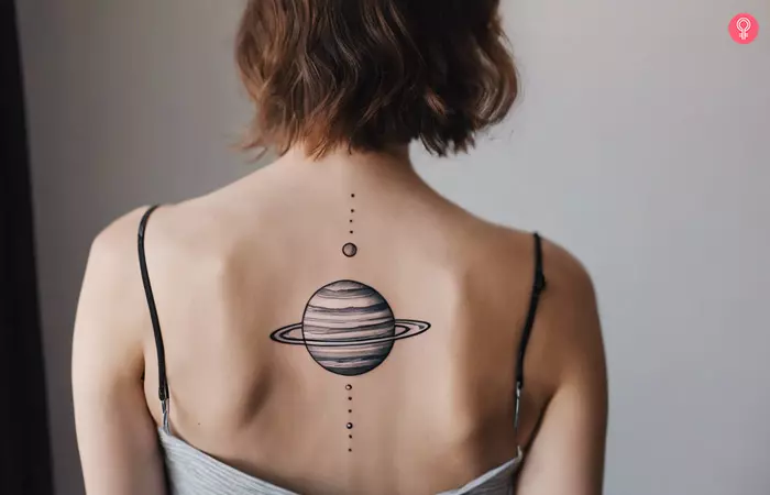 A woman with Jupiter planet tattoo on her back