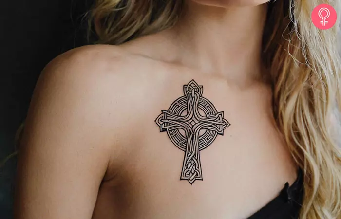 A woman with a Celtic cross and circle tattoo