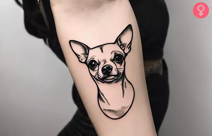 A woman with a Chihuahua outline tattoo