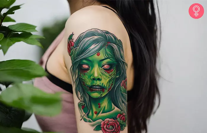 A woman with a Japanese-style zombie tattoo design on her upper arm