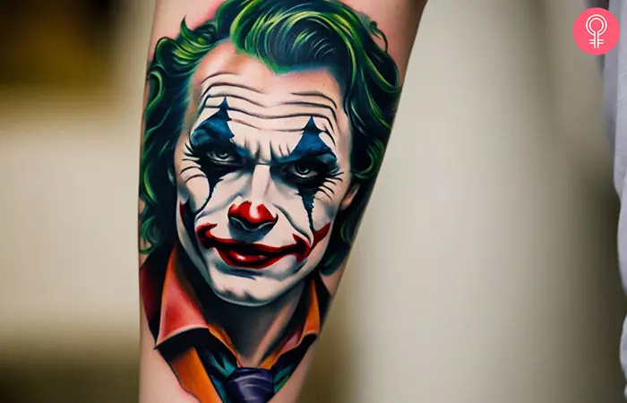 A woman with a Joker tattoo on her forearm
