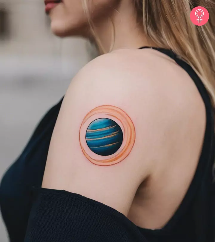 A woman with a Jupiter tattoo on her arm