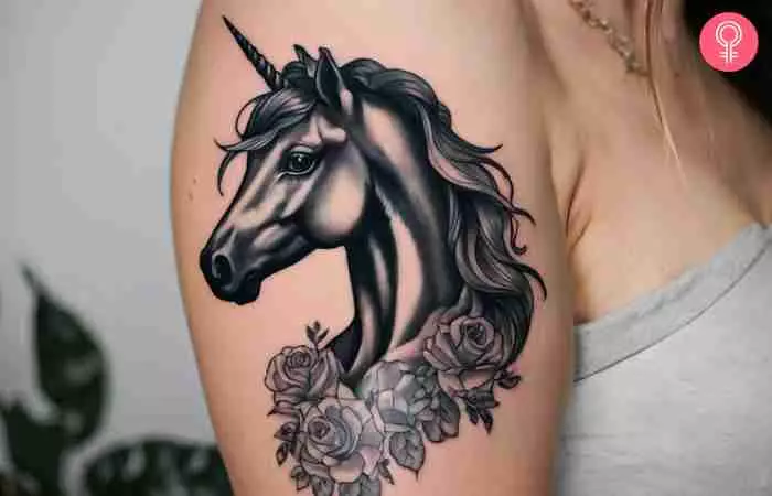 A woman with a black unicorn tattoo