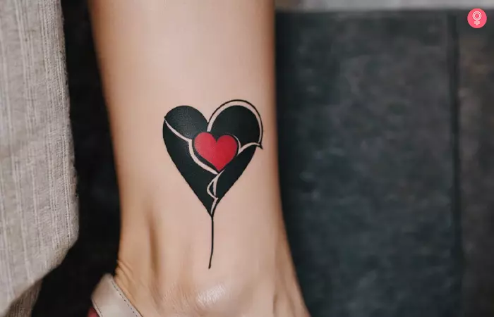 A woman with a broken heart tattoo