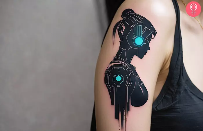A woman with a cyberpunk girl tattoo on upper arm